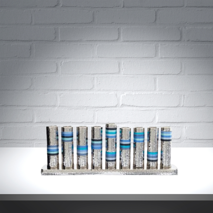 חנוכיית צינורות בצבעי ים, מרוקעת בעבודת יד